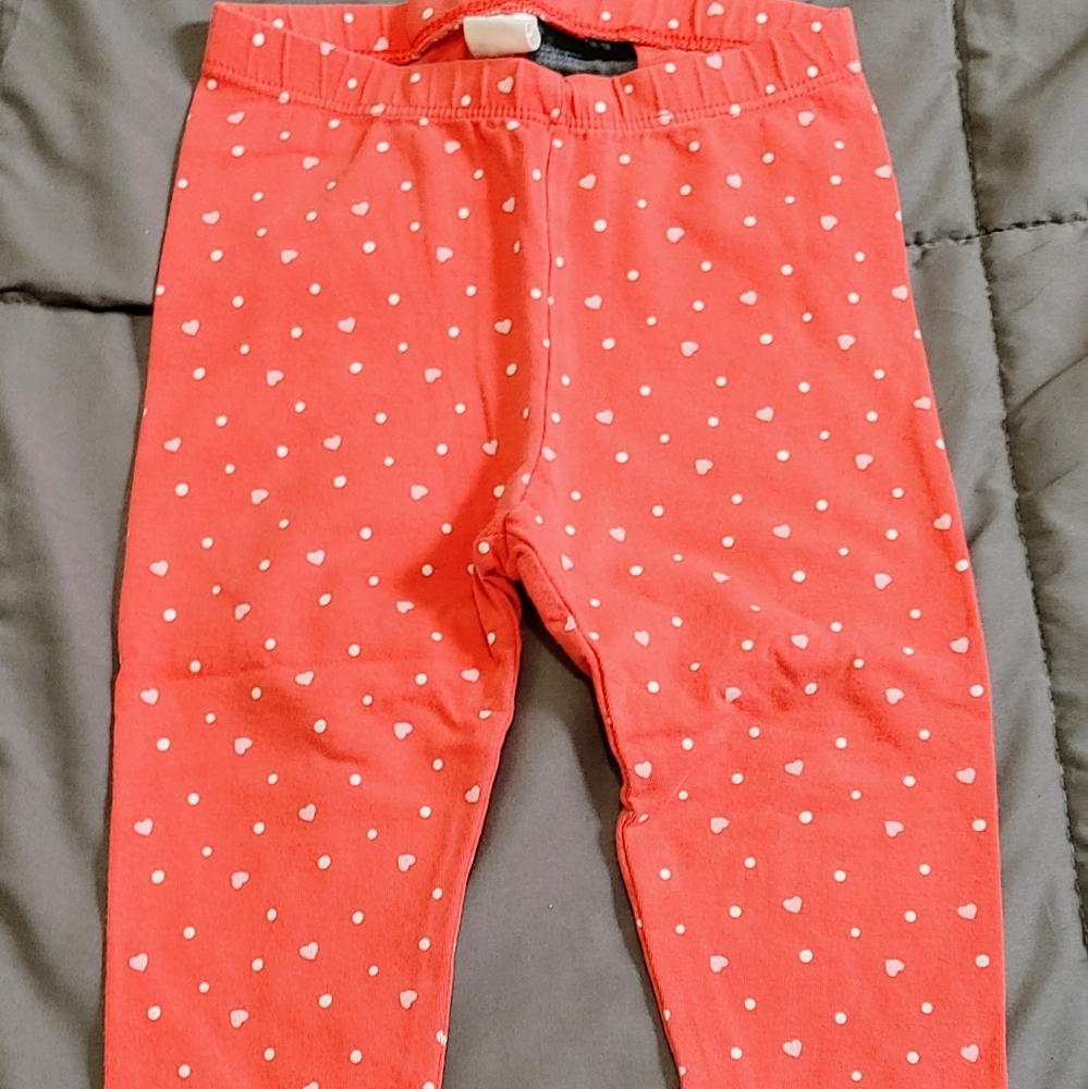 Red pants with pink hearts and white dots